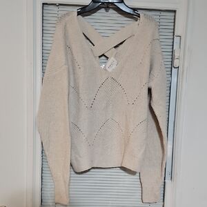 Stylish Beige V-Neck Sweater with Cross-Back